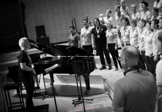 The choir rehearsing for Hand in Hand